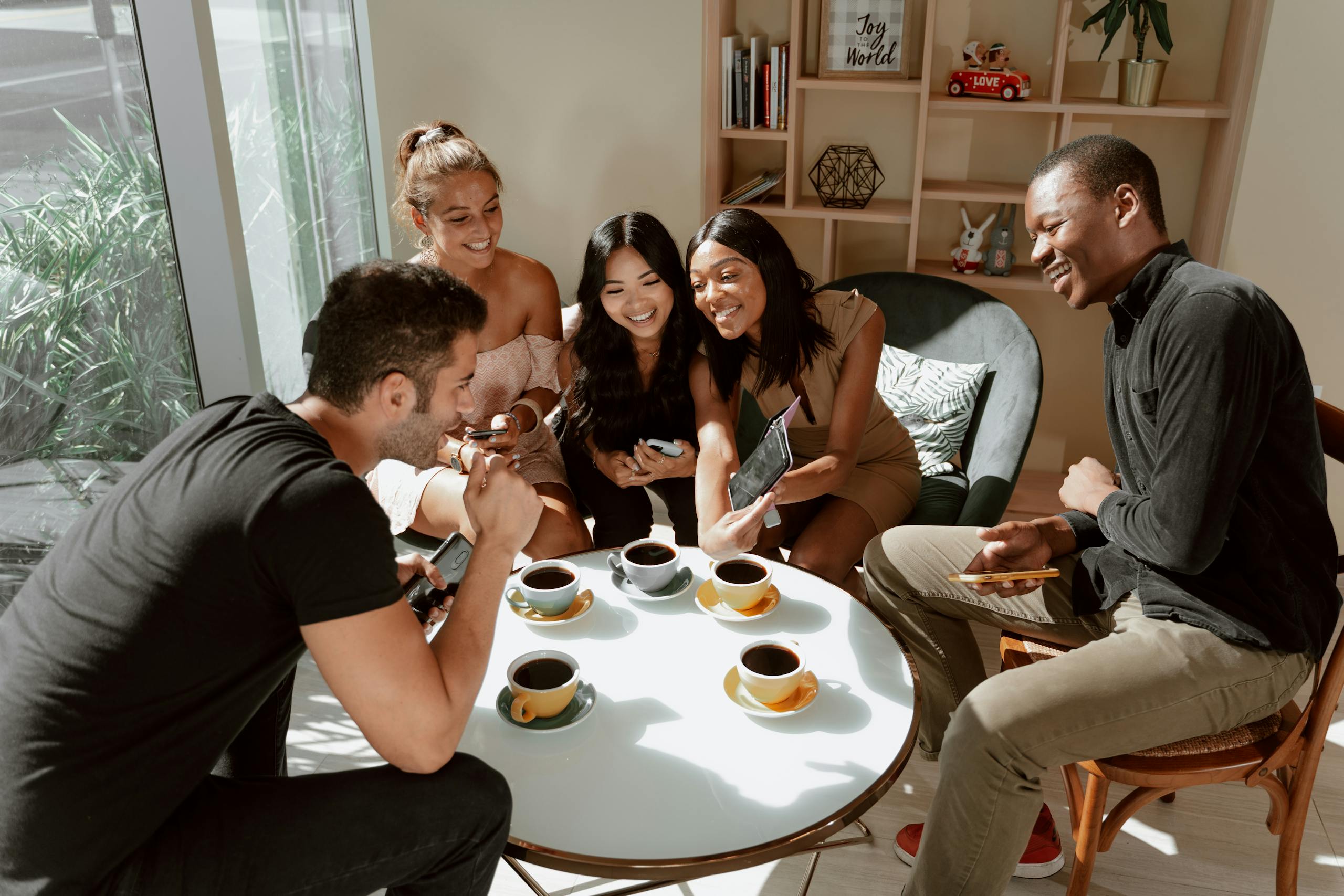 Travellers sharing coffee at a local café