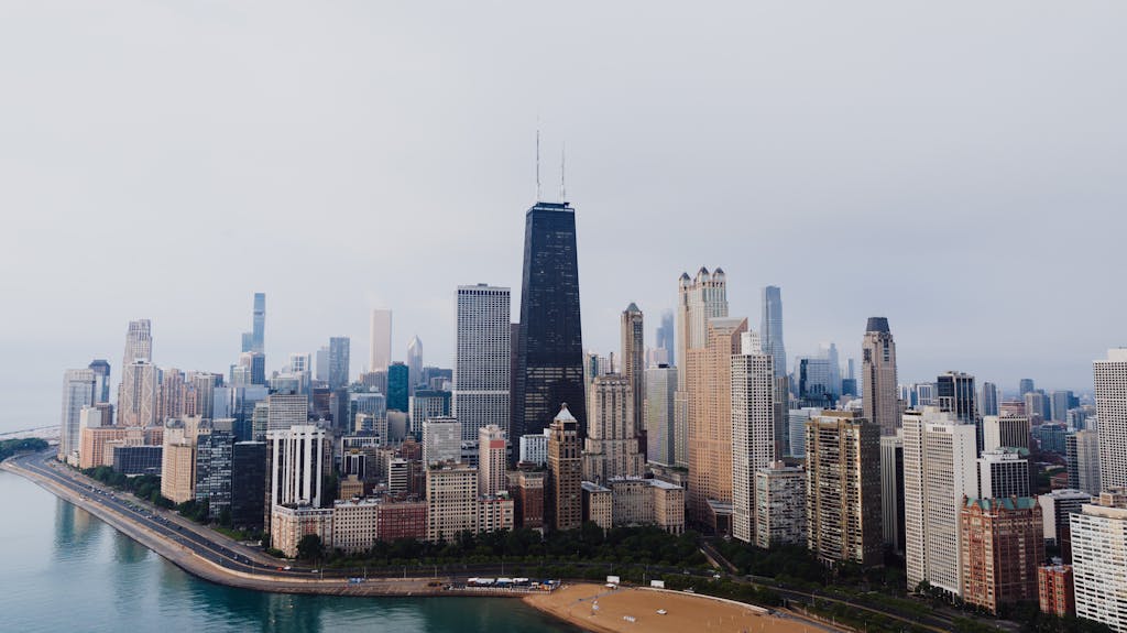 Aerial view of Chicago's downtown district featuring prominent skyscrapers and Lake Michigan.