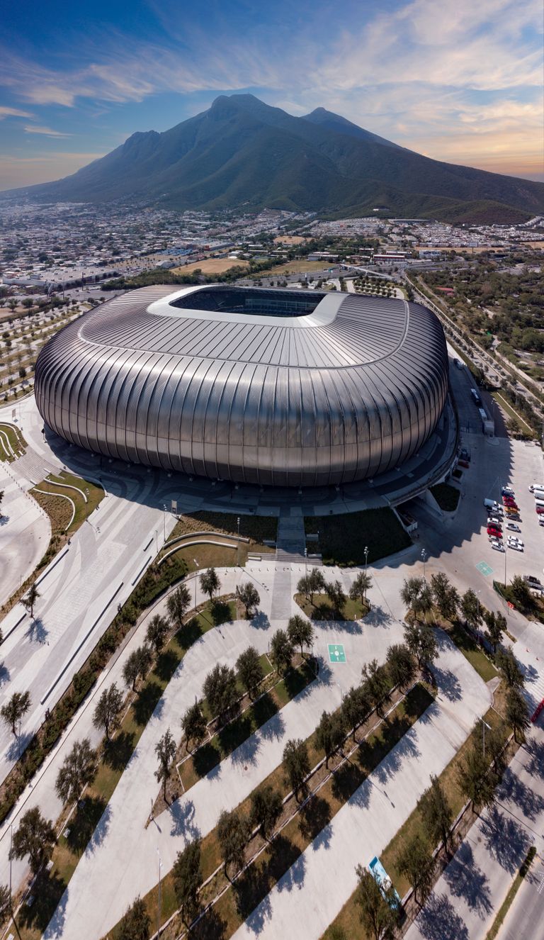 A stunning aerial shot of Estadio BBVA with mountainous backdrop in Guadalupe, Mexico.